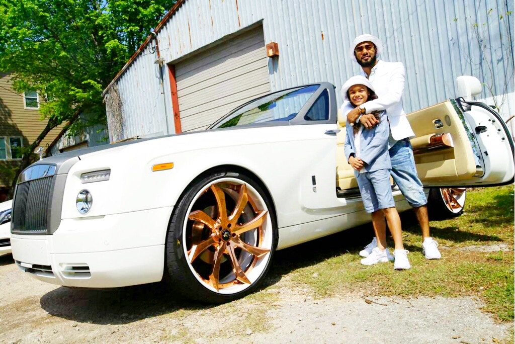 A personal moment with my son beside a customized Rolls-Royce.