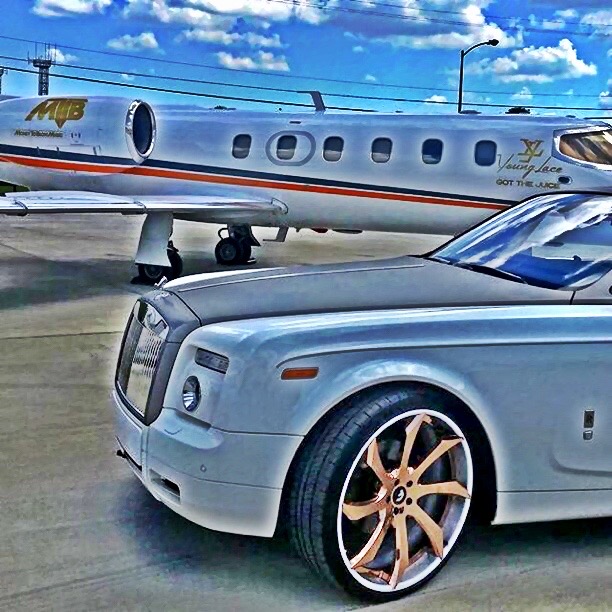 A Rolls-Royce and aircraft from the automotive archive.