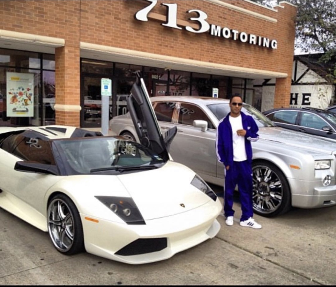 White Lamborghini and silver Rolls-Royce outside 713 Motoring.