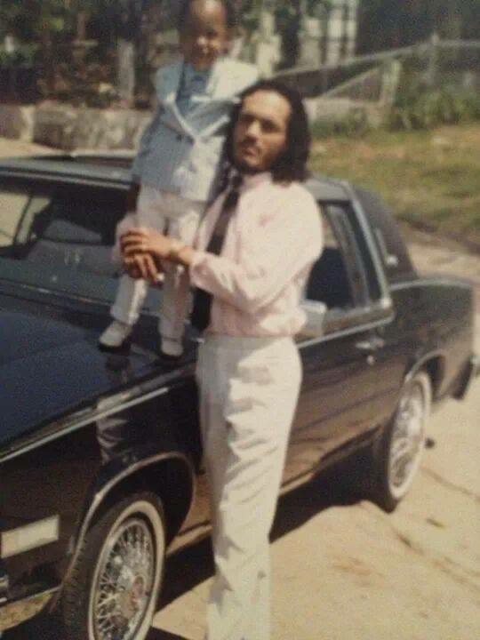 Childhood photograph beside a car