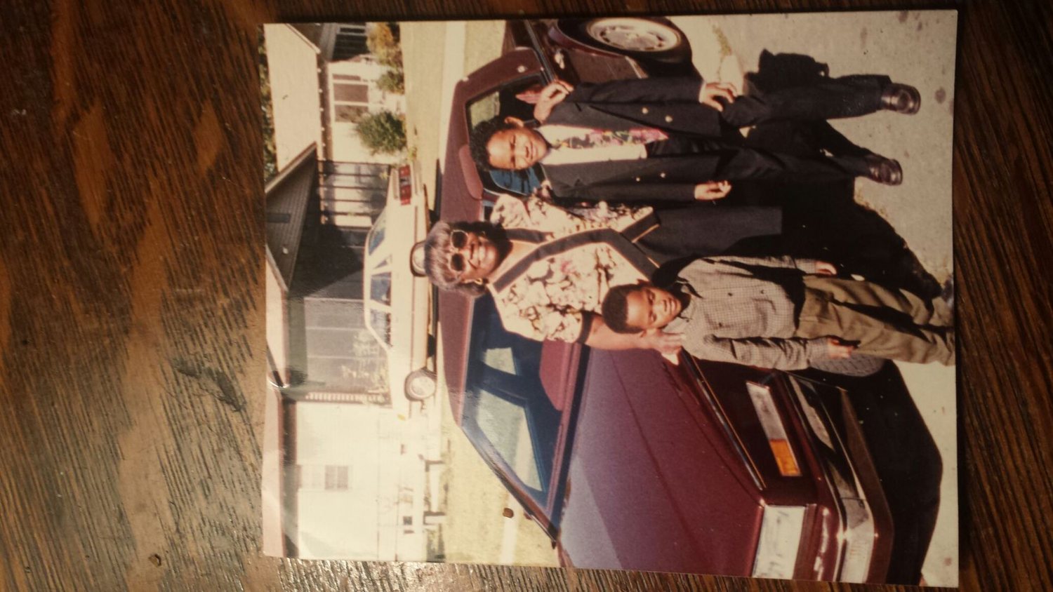 Family photograph beside a car