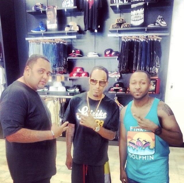 Music-industry collaborators photographed in a clothing shop