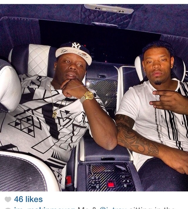 Music-industry collaborators inside a luxury vehicle