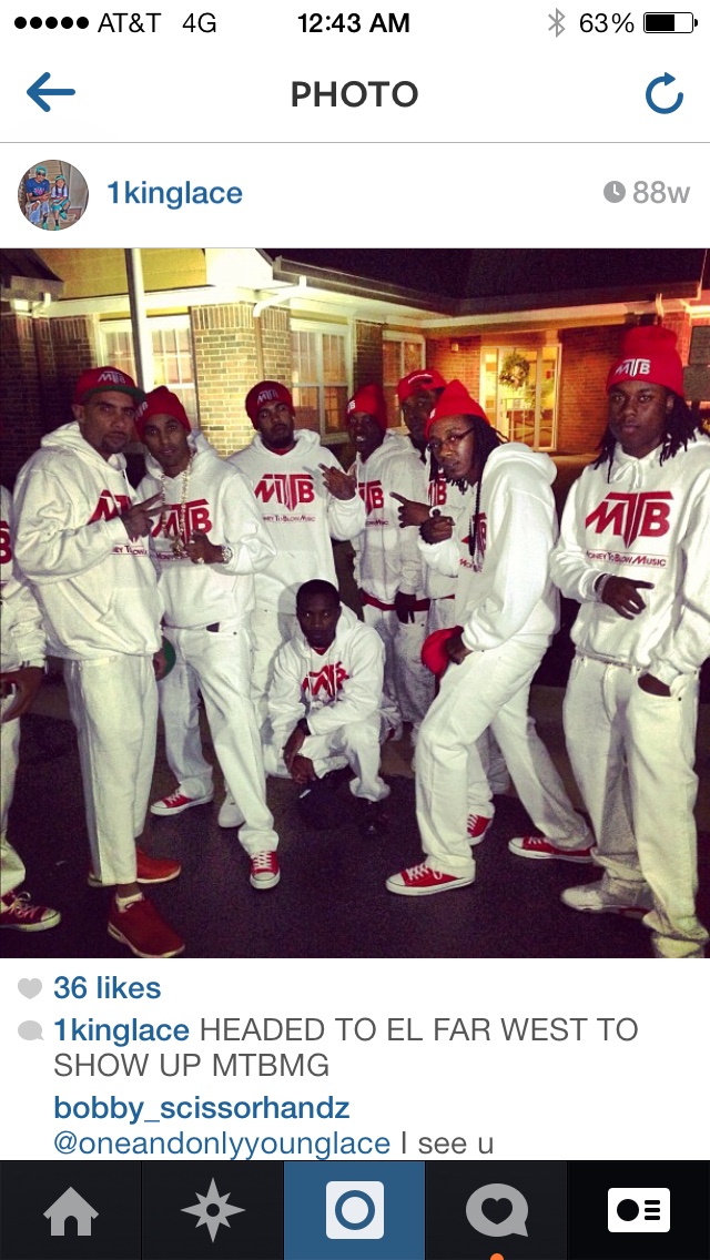 Money To Blow Music Group team wearing matching branded white tracksuits