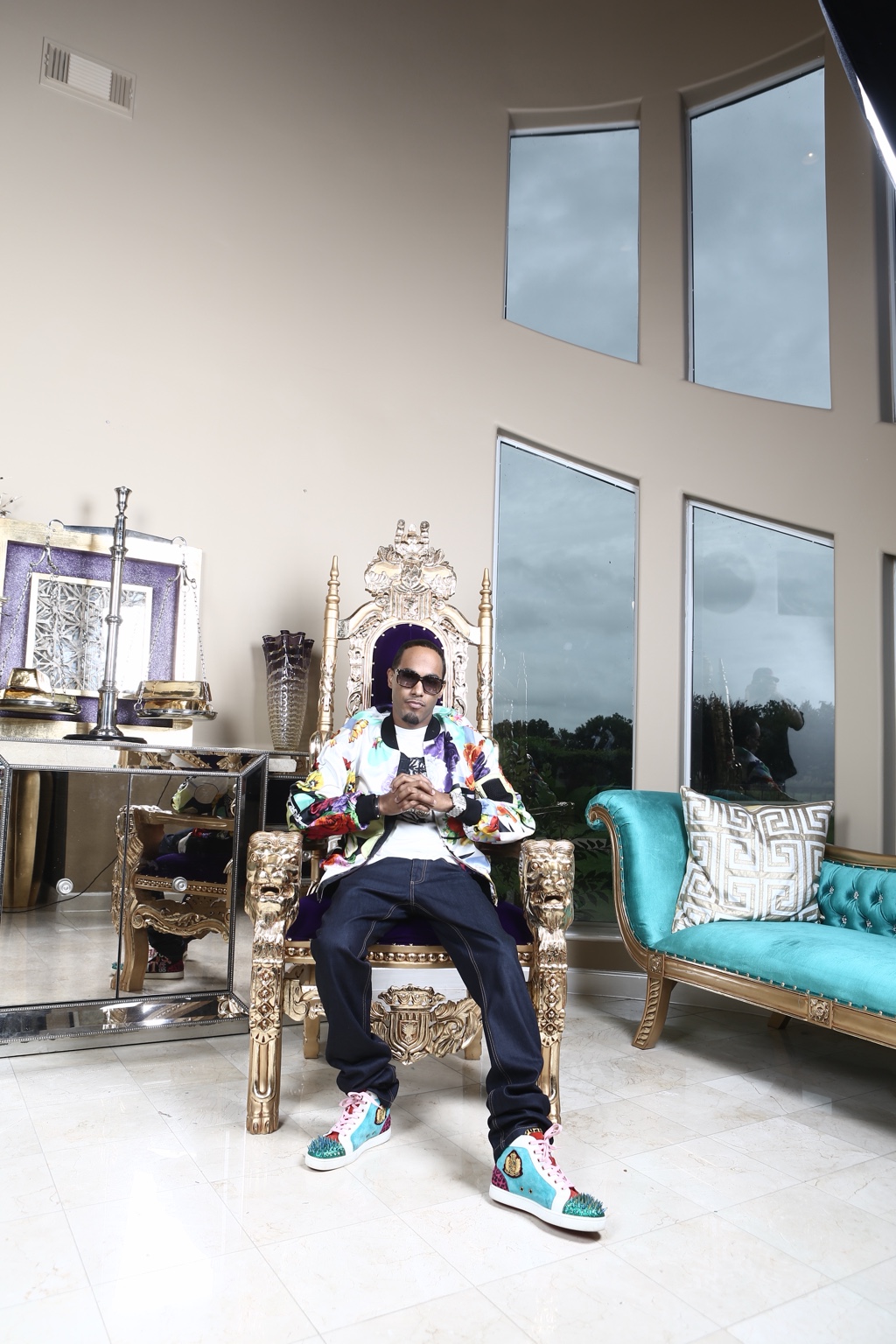 Young Lace seated in ornate chair during an archival lifestyle photo shoot