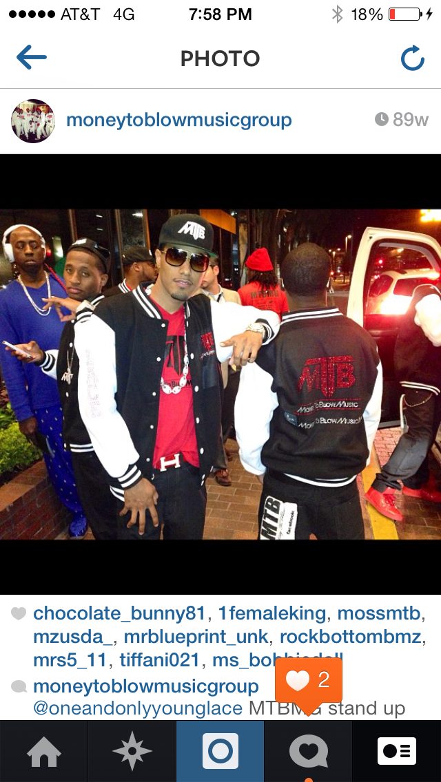 Young Lace in Money To Blow Music Group varsity jacket with colleagues